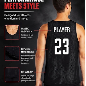 May include: Black mesh athletic jersey with the word "PLAYER" and the number "23" in white. The jersey features a classic crew neck and relaxed fit. The text "PERFORMANCE MEETS STYLE" is at the top.