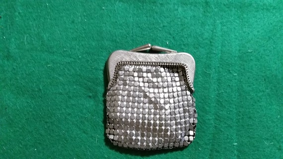 Small silver tile change purse.