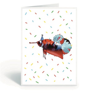 May include: A red, black, and blue betta fish wearing a party hat with a streamer. The fish is swimming in a white background with colorful confetti.