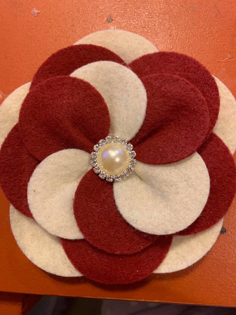 Two or three color options. The Glam Collection Ky Flower Corsage-