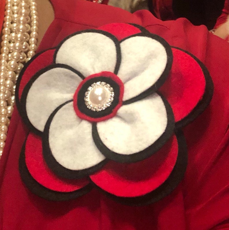 Two or three color options. The Glam Collection Ky Flower Corsage-