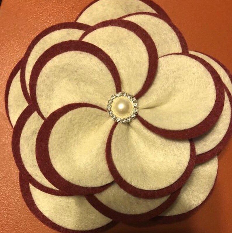 Two or three color options. The Glam Collection Ky Flower Corsage-