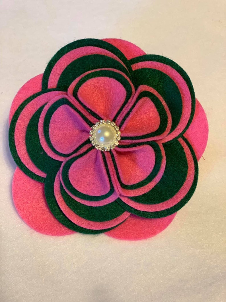 Two or three color options. The Glam Collection Ky Flower Corsage-