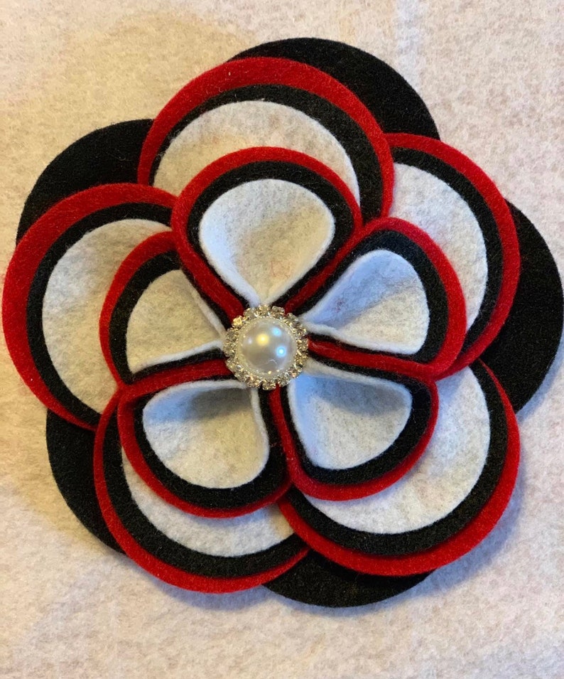 Two or three color options. The Glam Collection Ky Flower Corsage-