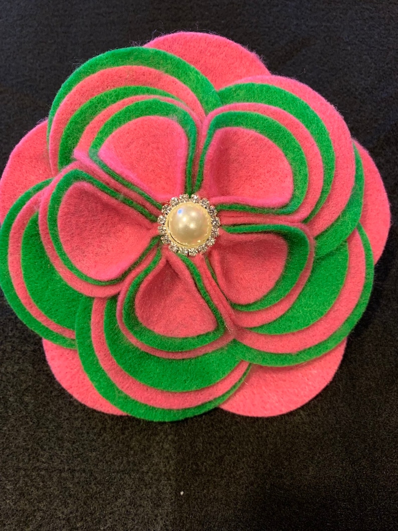 Two or three color options. The Glam Collection Ky Flower Corsage-