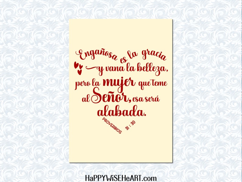 May include: A cream-colored card with red script. The text reads "Enga&ntilde;osa es la gracia y vana la belleza, pero la mujer que teme al Se&ntilde;or, esa ser&aacute; alabada. PROVERBIOS 31:30." The website HAPPYWISEHEART.com is at the bottom.