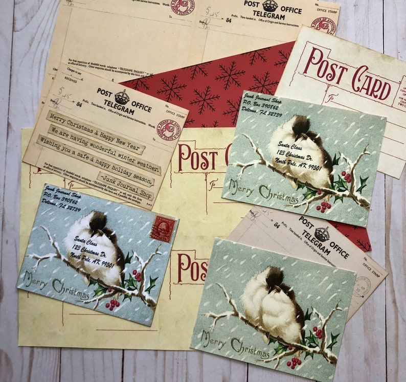 May include: Vintage Christmas postcards with a blue and white snowy scene featuring birds on a branch with red berries. The text "Merry Christmas" is printed on each card.
