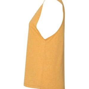May include: A mustard yellow sleeveless tank top with a relaxed fit.