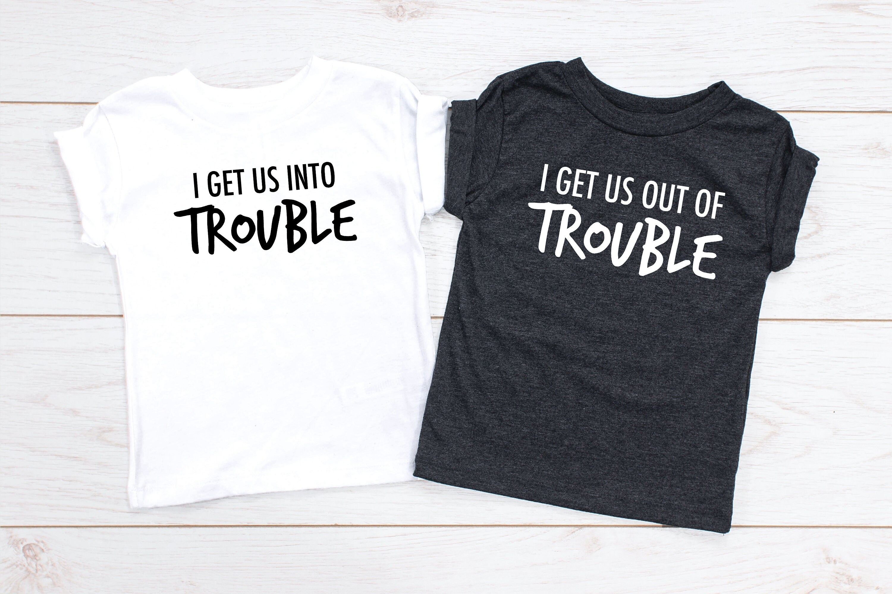 The new t-shirt. Get us out. Get out надпись. I get us into trouble футболки. Get us out.