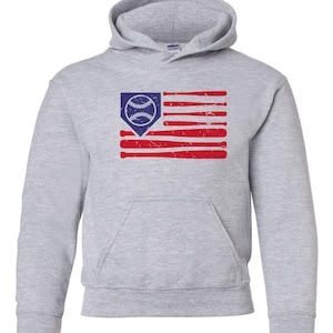 May include: A gray hooded sweatshirt with a distressed American flag design featuring a baseball and bats. The flag is red, white, and blue.