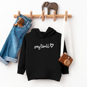 May include: Black hooded sweatshirt with the text "softball" and a white heart on the front.