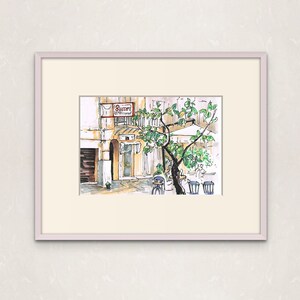 May include: A watercolor painting of a street scene in Italy. The painting features a cafe called "Bucceri" with a tree and tables and chairs outside.