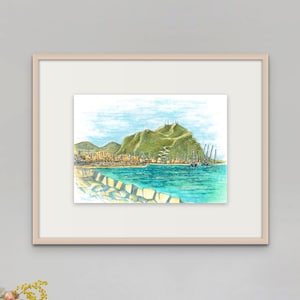 May include: A watercolor painting of a harbor scene with a green hill in the background. The water is a bright blue and there are several boats docked in the harbor. The painting is framed in a light wood frame.