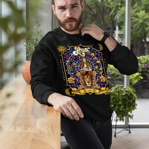 May include: Black sweatshirt with a colorful zodiac design featuring a lion and the text "Leo".