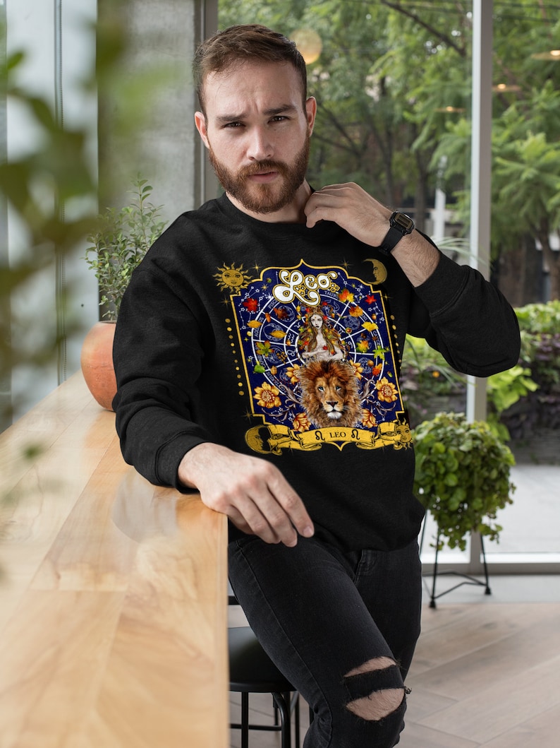 May include: Black sweatshirt with a colorful zodiac design featuring a lion and the text "Leo".
