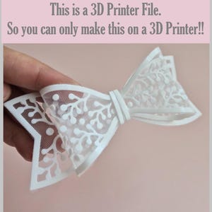 May include: A white 3D printed bow with a delicate, intricate branch-like pattern and a mesh-like texture. The image includes the text: This is a 3D Printer File. So you can only make this on a 3D Printer!!