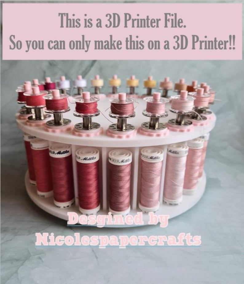 May include: A white circular tiered thread rack holding multiple spools of pink and red thread, with text stating: This is a 3D Printer File. So you can only make this on a 3D Printer!! Designed by Nicolespapercrafts.