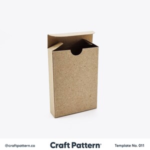 May include: A brown cardboard box with a flap top. The box is open and the inside is visible. The box is on a white background.