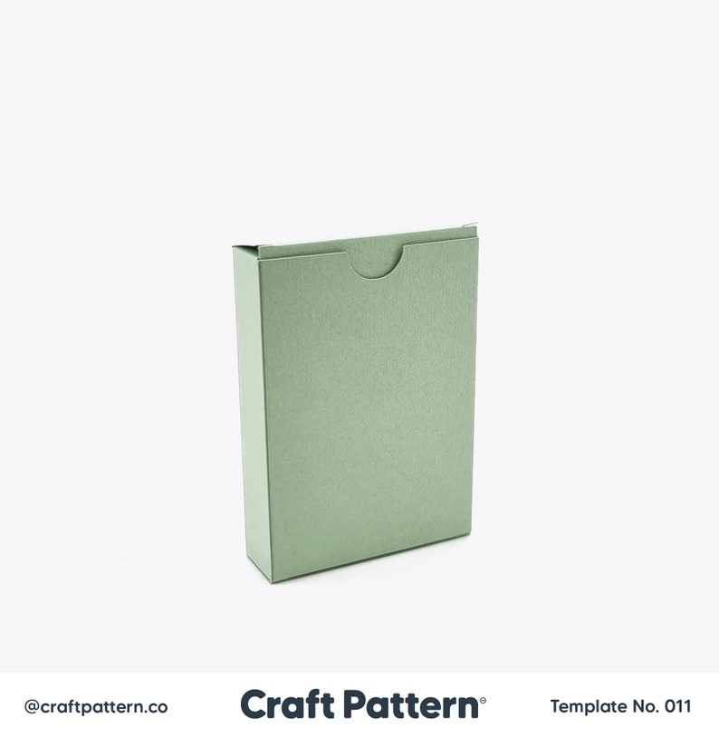 May include: A green cardboard box with a flap top. The box is designed to be assembled and has a simple, modern design.  Craft Pattern Template No. 011.