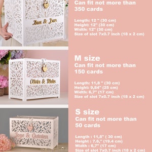 May include: White laser-cut wooden card boxes in three sizes, each with a decorative floral pattern. The boxes feature names in gold lettering and a heart-shaped lock. The largest box is 12 inches (30 cm) in length, height, and width.