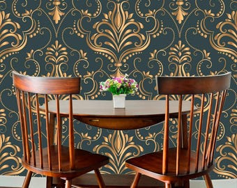 May include: Two dark brown wooden chairs with vertical slats and a matching semi-circular wooden table. The background features dark teal wallpaper with a repeating gold damask pattern. A small white pot holds a bouquet of colorful flowers.