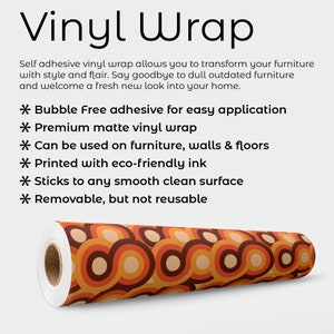 May include: A roll of matte vinyl wrap featuring a repeating pattern of interlocking orange, brown, and beige circles. The text reads: Vinyl Wrap, Self adhesive vinyl wrap allows you to transform your furniture with style and flair. Bubble Free adhesive, Premium matte vinyl wrap, Can be used on furniture, walls & floors, Printed with eco-friendly ink, Sticks to any smooth clean surface, Removable, but not reusable.