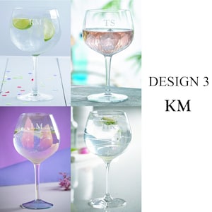 May include: Three clear glass gin glasses with different designs. The glasses are filled with clear liquid and ice. The glasses are engraved with the initials "KM", "TS", and "LM". The text "DESIGN 3" and "KM" is visible in the image.