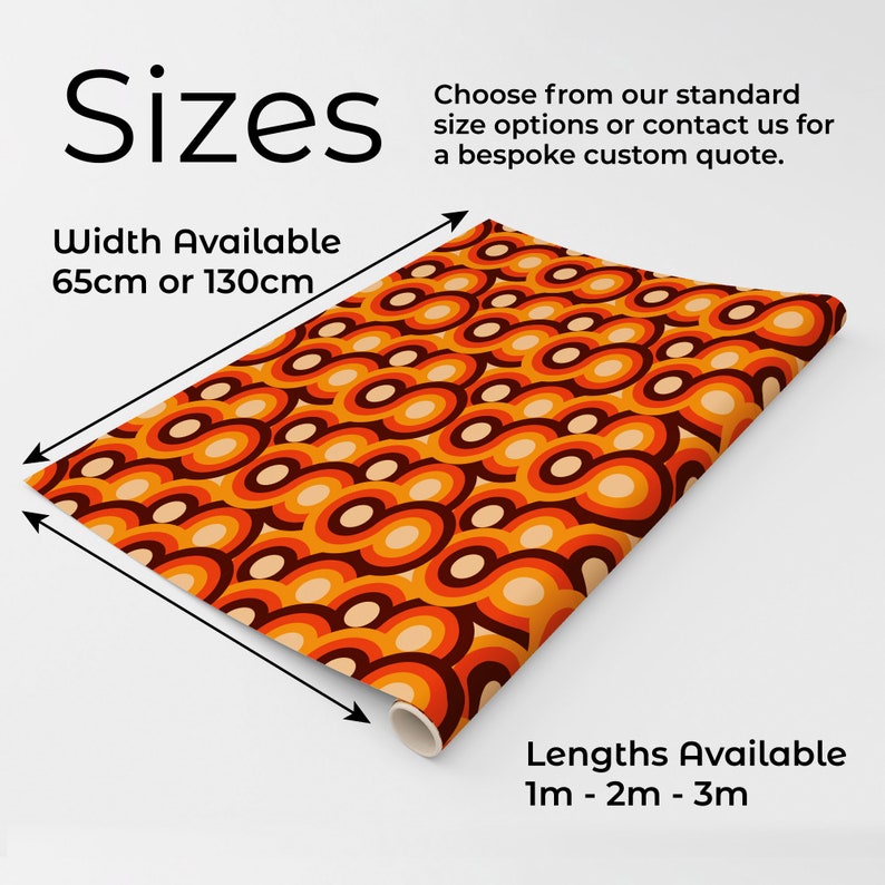 May include: A roll of wallpaper featuring a repeating pattern of overlapping circles in shades of orange, brown, and cream. Text indicates widths of 65cm or 130cm and lengths of 1m, 2m, or 3m. The design consists of concentric rings in warm tones.