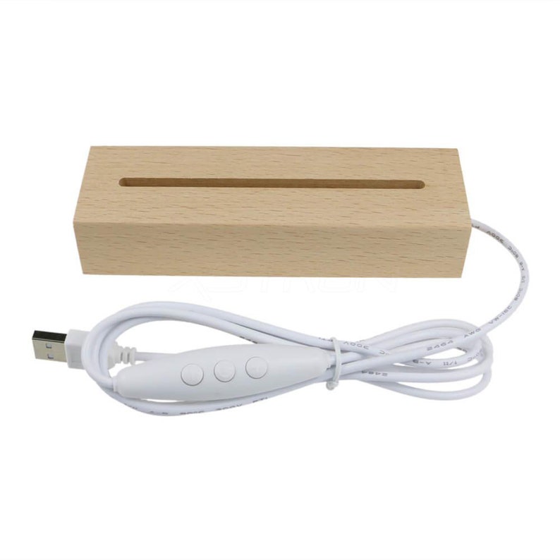 May include: A wooden display stand with a slot for displaying small items. The stand is lit by a white LED strip that is powered by a USB cable with a three-button switch.