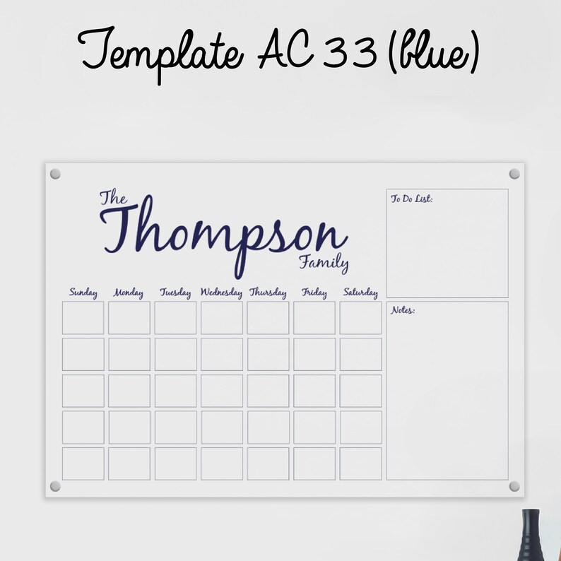 May include: White dry-erase board with a weekly calendar grid, a to-do list section, and a notes section. The board has the text "The Thompson Family" at the top.