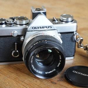 Olympus OM-1 camera with Zuiko 50mm lens.