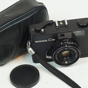 Konica C35 rangefinder, works! Black version.