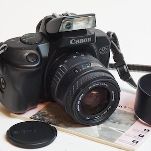 Canon EOS 750qd SLR camera with Sigma 35-70mm lens