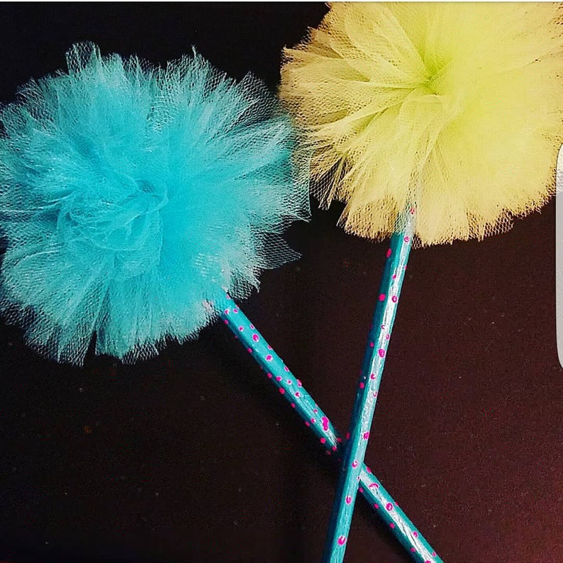 turquoise and lime green pencils with tulle pom pom toppers