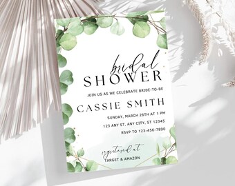 May include: A white bridal shower invitation featuring green eucalyptus leaves and gold glitter. The invitation reads "bridal shower" and includes the bride-to-be's name, date, time, address, and RSVP details. It also states "registered at Target & Amazon".