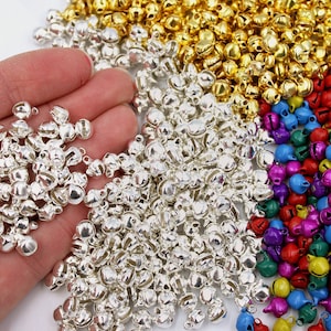 May include: A large pile of silver jingle bells, perfect for crafting or adding a festive touch to your projects.