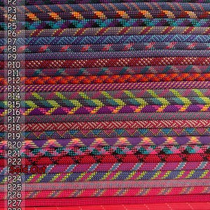 May include: A collection of twenty-nine braided cords arranged in parallel rows, each featuring distinct colour combinations including purple, blue, orange, green, red, and pink, with labels P1 through P29 and the text Sold Out visible.