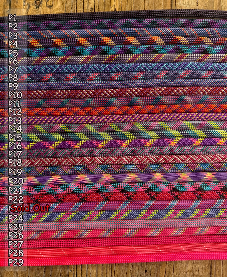 May include: A collection of twenty-nine braided cords arranged in parallel rows, each featuring distinct colour combinations including purple, blue, orange, green, red, and pink, with labels P1 through P29 and the text Sold Out visible.