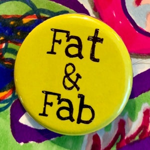 May include: A yellow button with black text that reads "Fat & Fab".