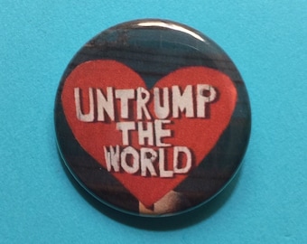 Un-Trump the World pinback button, save democracy, resist