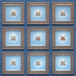 May include: Nine square ceiling tiles with a blue background and gold trim. Each tile features a white flower design in the center.