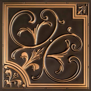 May include: A decorative tile with a copper finish and an intricate floral design. The tile has a dark brown background and the design is raised and embossed.