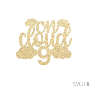 May include: Gold glitter cake topper with the words "one cloud nine" and a cloud design.