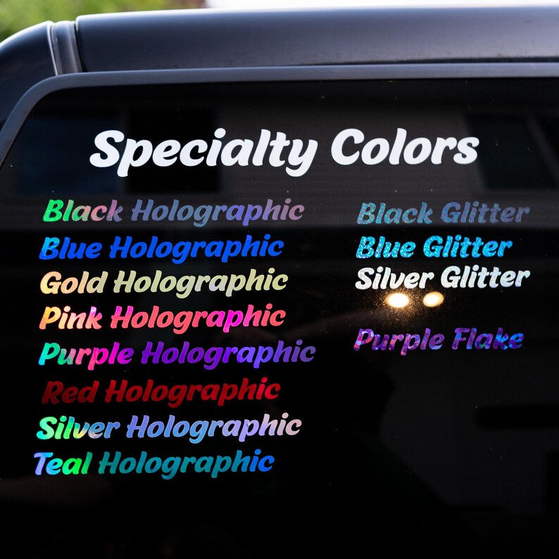 May include: A colour chart titled Specialty Colours displaying text samples in various finishes. The list includes Black, Blue, Gold, Pink, Purple, Red, Silver, and Teal Holographic, alongside Black Glitter, Blue Glitter, Silver Glitter, and Purple Flake.