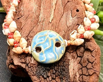 カヘレラニ シェル ブレスレット: 珍しいカウアイ島の貝殻、ハワイアン