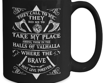 May include: Black coffee mug with a white design featuring a Viking axe and the text "They call to me. They bid me to take my place among them in the halls of Valhalla where the brave may live forever."