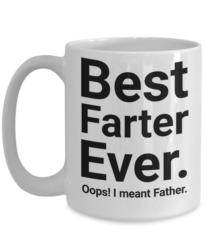 May include: White ceramic mug with black text: "Best Farter Ever." Below, the text reads "Oops! I meant Father." The mug features a curved handle, suitable for hot beverages.