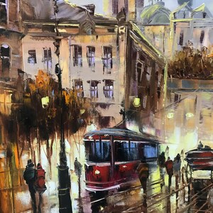 May include: An oil painting of a European city street at dusk. A red tram is on the tracks, with people walking on the wet pavement. Buildings with lit windows line the street, and a lamppost is in the foreground.