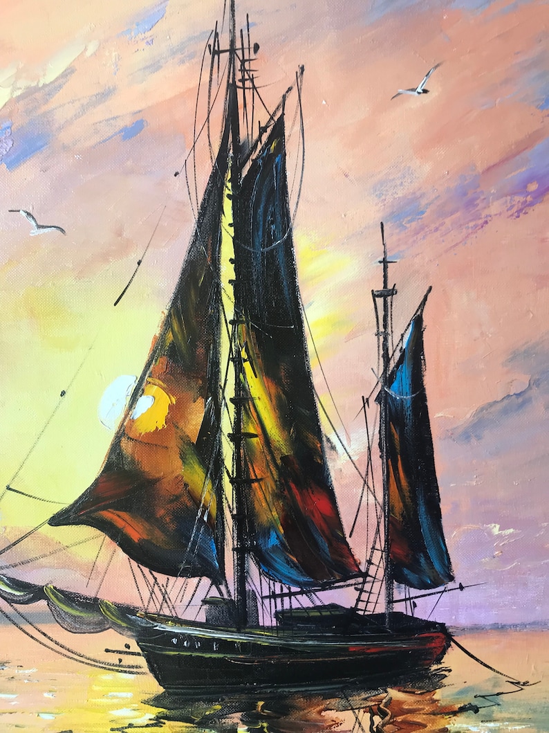 May include: A painting of a black sailboat with sails billowing in the wind. The sailboat is in the foreground of the painting, with a sunset sky in the background. The sky is painted in shades of pink, orange, and yellow.