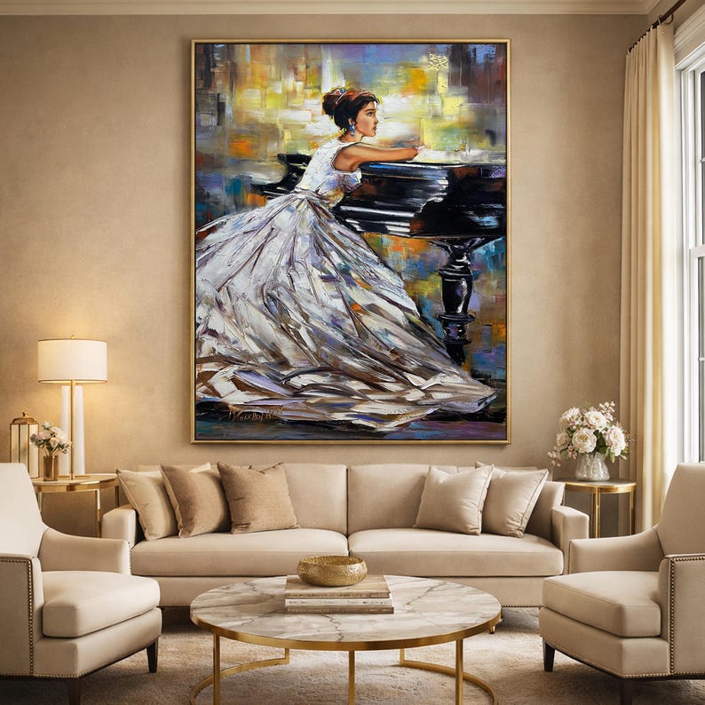 May include: An oil painting depicts a woman in a white gown leaning on a black piano. The artwork has a gold frame and is displayed above a beige sofa. The background features abstract brushstrokes in yellow, blue, and orange.